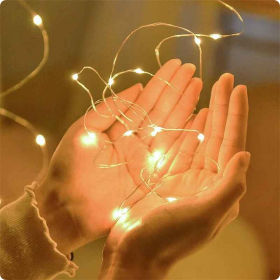 guirlande lumineuse exterieur Comète dans des mains