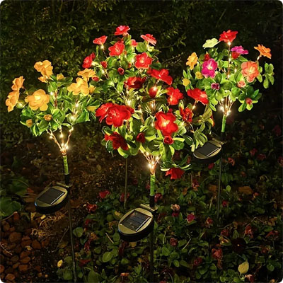 lampe solaire jardin Azalée éclairée la nuit dans un jardin