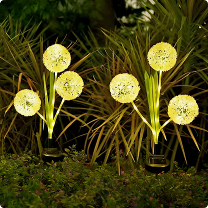 Lampe solaire Pissenlit blanc chaud décorant un buisson