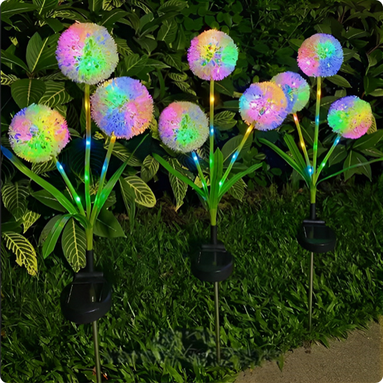 Lampe solaire Pissenlit multicolore au bord d'une allée