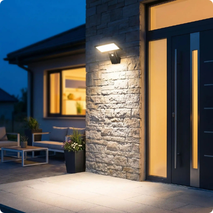 Projecteur led extérieur détecteur de mouvement Céléno éclairant une entrée de maison